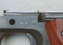 Colt 1911 frame with 10mm cutout.jpg