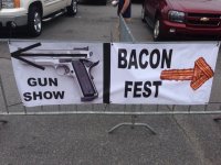 A-Sign-in-Arkansas-Points-One-Way-For-Gun-Show-and-the-Other-For-Bacon-Show.jpg