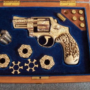 In the box, all dressed up.  Nickel plated moon clips with hydra-shocks, and 6 hand loaded 45 Autorim.  I need nickel plated autorim if anyone has 6.