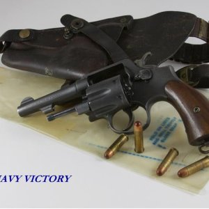 S&W Victory, shown with holster, waterproof pouch and tracer ammo.