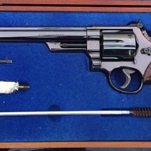 Four screw model 29 with bright blue finish and 8 3/8 inch barrel that shipped in July of 1959.