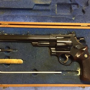 Three screw Model 29-1 with bright blue finish and 8 3/8 inch barrel in the original clamshell presentation case.