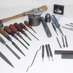 In 1979 I had the great fortune to attend the Smith and Wesson armorer's school at the factory.
 Following is a photo of my tools some from the factor