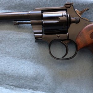 A Colt Officers model shipped in 1927. gun has Roper sights and grips.The gun has been modified to short hammer throw for bullseye shooting.