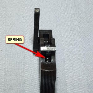 spring to actuate hand lever