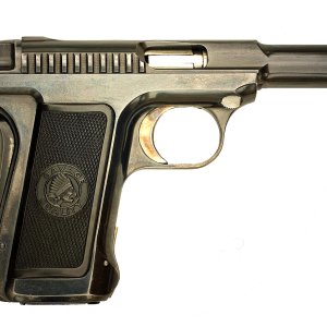 The Savage pocket pistols of the early 20th century were among the first to use higher-capacity staggered-stack magazines.  This Model 15 in .32 ACP c