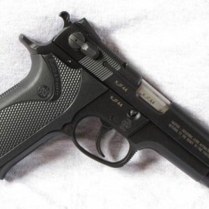 5906 Modelo Militar, KJF44xx.  Trademark on frame stamped, serial number laser etched on right side of frame, slide, and barrel.  Reversible mag catch