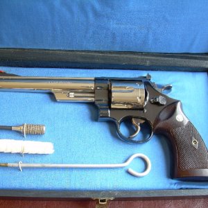 Pre-model 29, four screw, 6 1/2 inch barrel, serial S17428x, shipped April 7, 1958.  Shipped as a blued gun with a four inch barrel, but was returned 