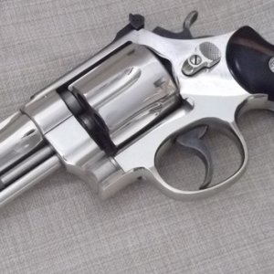 Pre-model 27, five screw, five inch with factory nickel finish, shipped to Winchester Repeating Arms Company on December 10, 1951.  Wearing a set of E