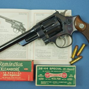 38-44 Outdoorsman SN 423xx w/ of box of Rem Hi Speed 38 sp. and box of Rem. 38-44 Metal Point bullets.