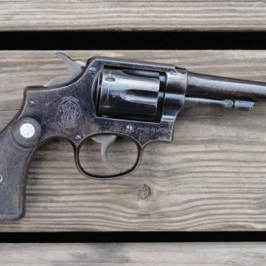 Smith & Wesson Pre-Victory 4" in .38 S&W caliber.  This guns serial number falls in line as being in the first shipment that were destined for Africa.