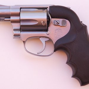 This model 60 is equipped with Bianchi "Lightning" grips (no longer made), which provide a built-in hammer shroud for discreet carry.