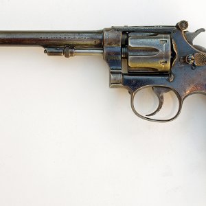 Here's a grizzled veteran of the bullseye circuit in the early part of the 20th Century. It's a 22/32 Hand Ejector, made on the "Bekeart" pattern. Thi