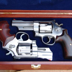 A cased duo of stainless big bores - a 625 and a 624.