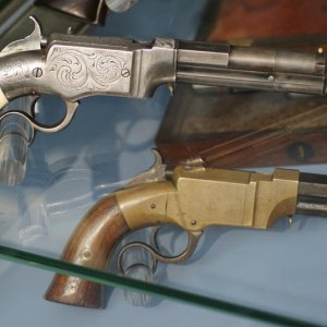 small frame S&W on top of the early cabinet